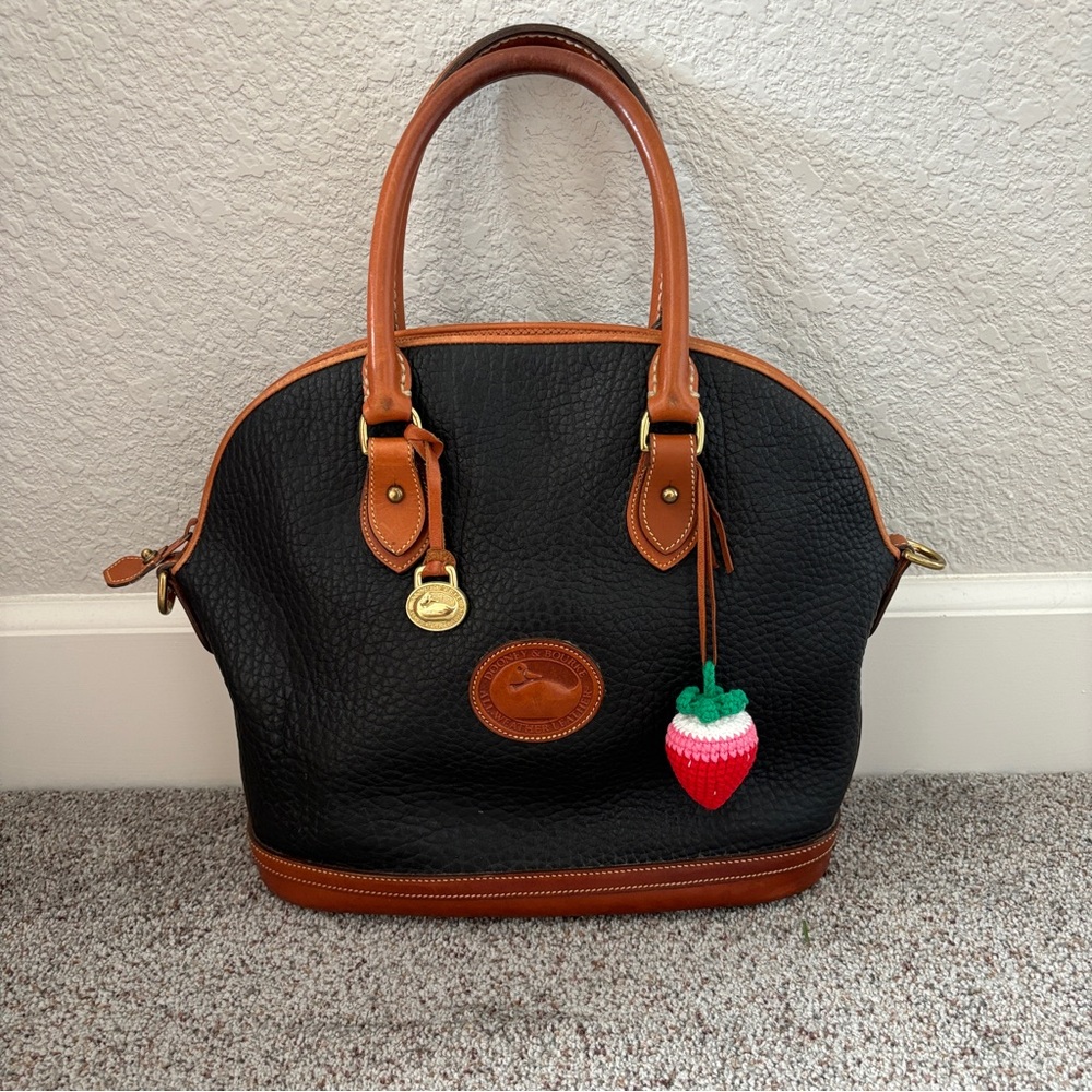 Dooney & Bourke Black and Tan Satchel with Charm
